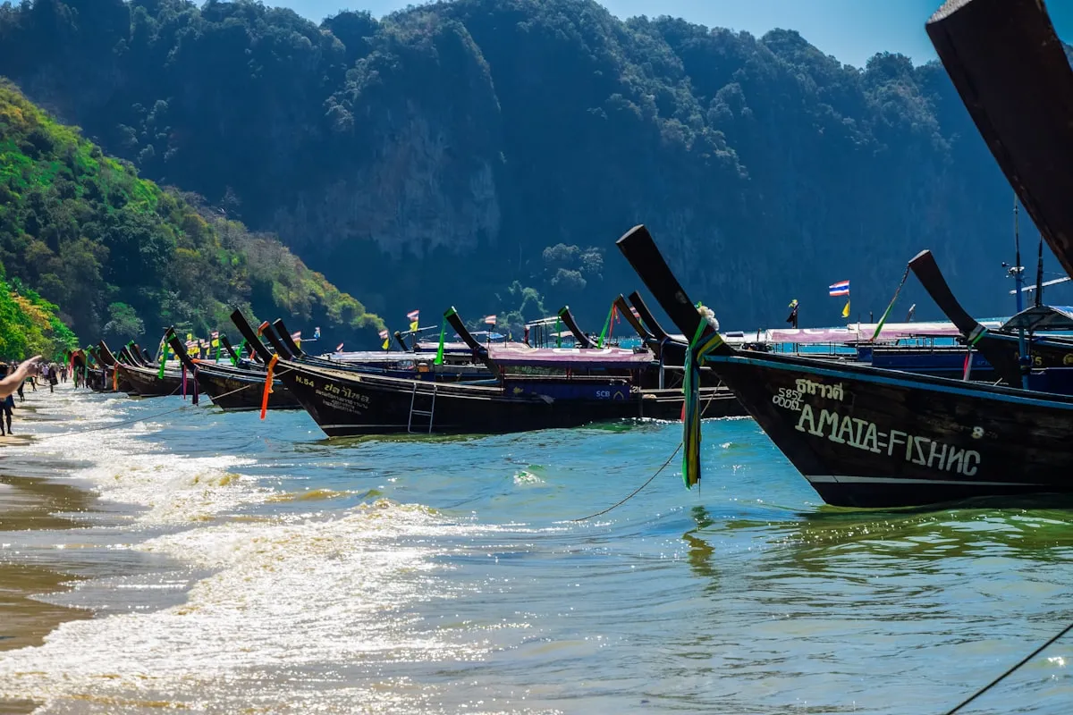 Colorful longtail boat on shore in Krabi Thailand