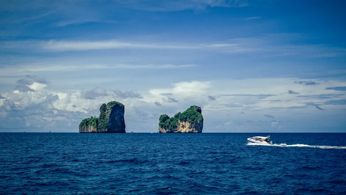 Yacht in turquoise tropical waters near islands